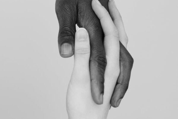holding hands in black and white photo