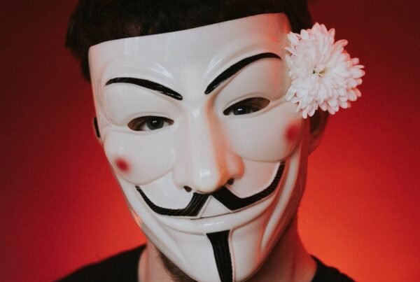 freedom fighter in anonymous mask on red background