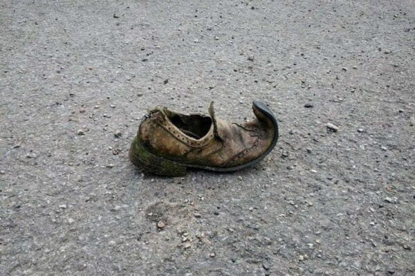 A very old worn discarded shoe on the street - Skendong Poetry