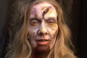A woman in make up like a zombie