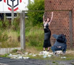 photographer taking a photo of a model