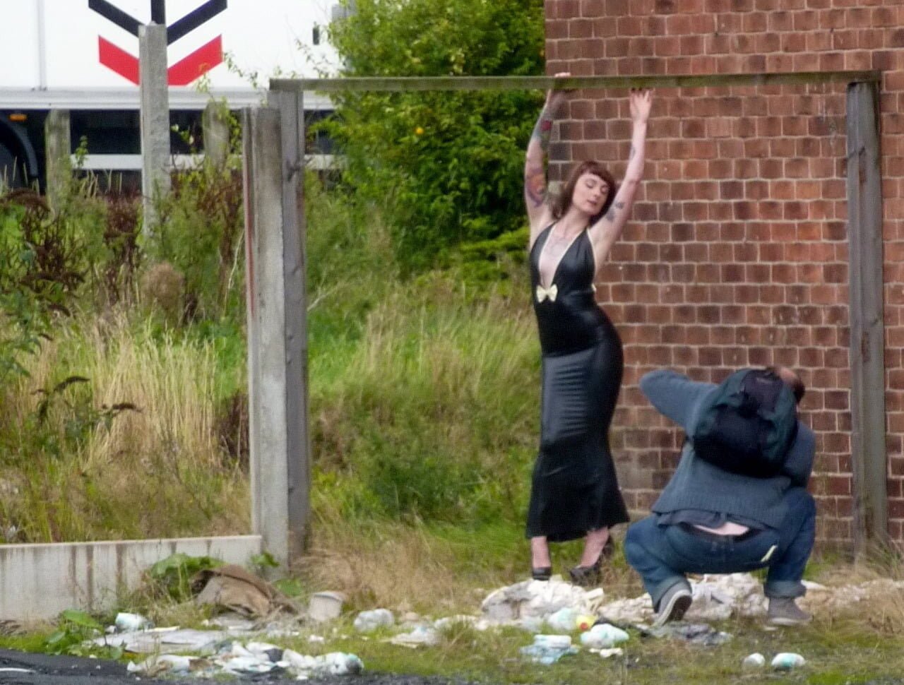 photographer taking a photo of a model