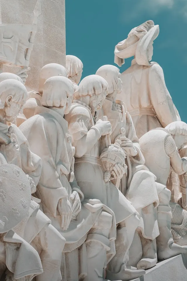 A statue of a group of people sitting next to each other