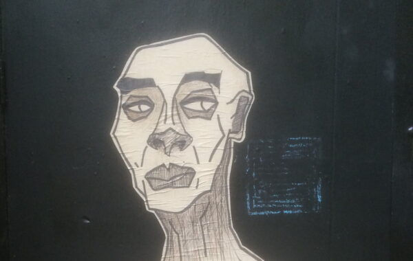 a strange looking man - street art photo by skendong